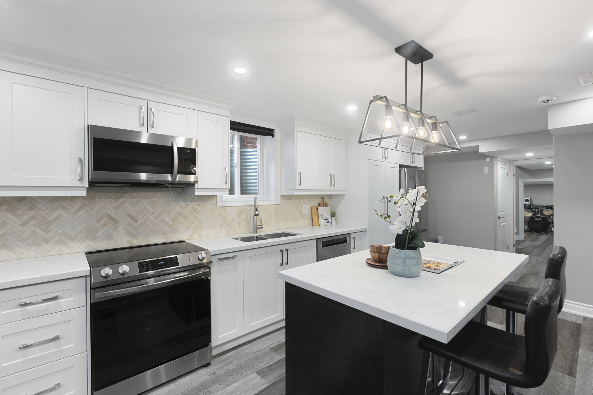 Second kitchen with herringbone backsplash