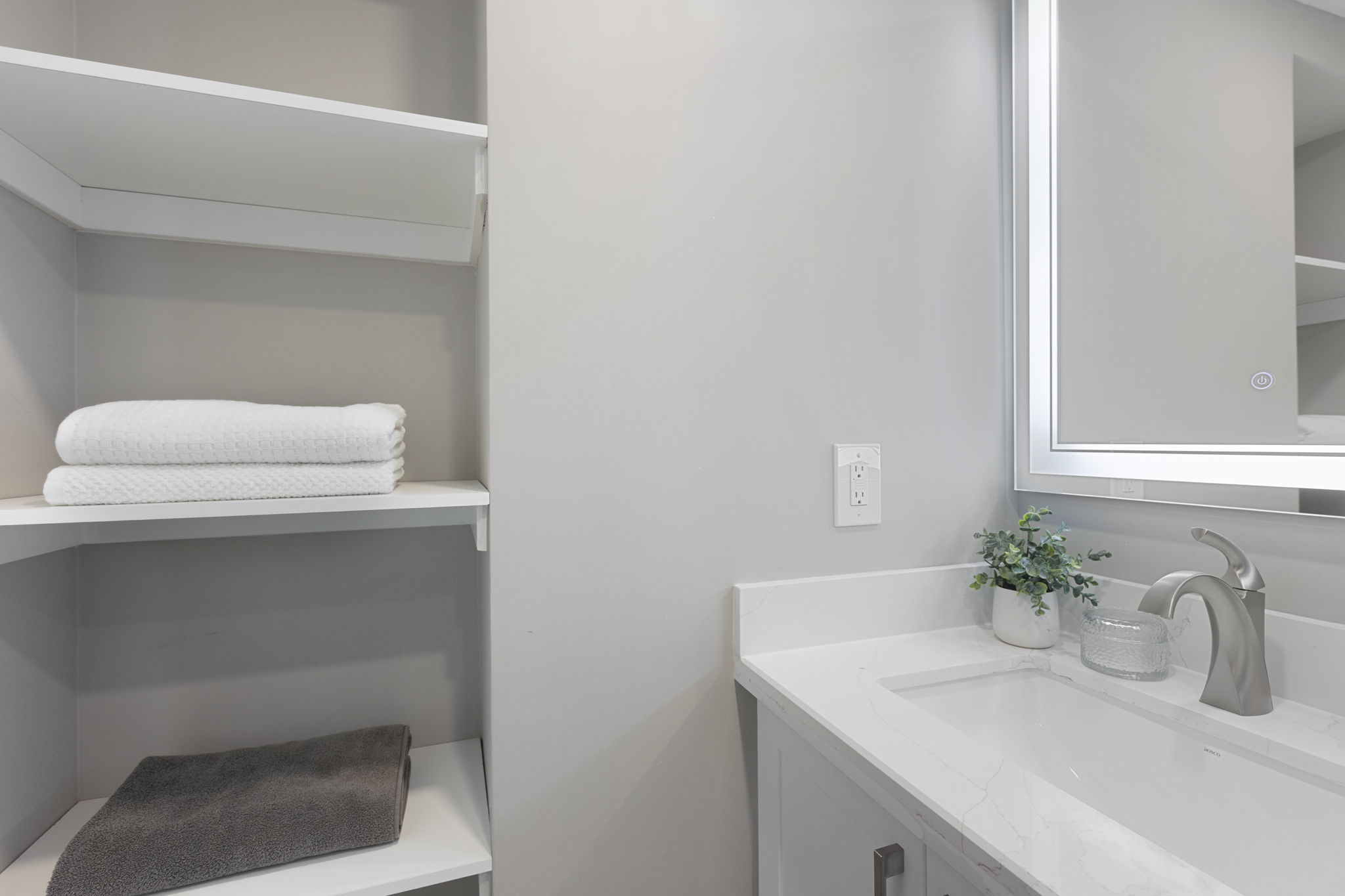 Lower level vanity and linen storage