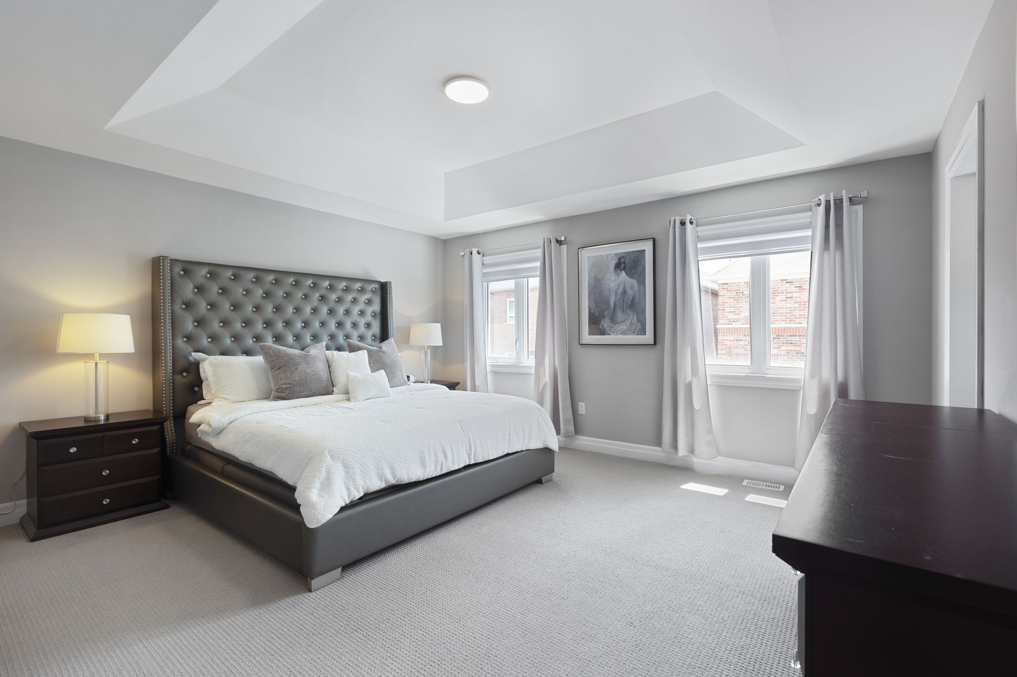 Primary bedroom with tray ceiling