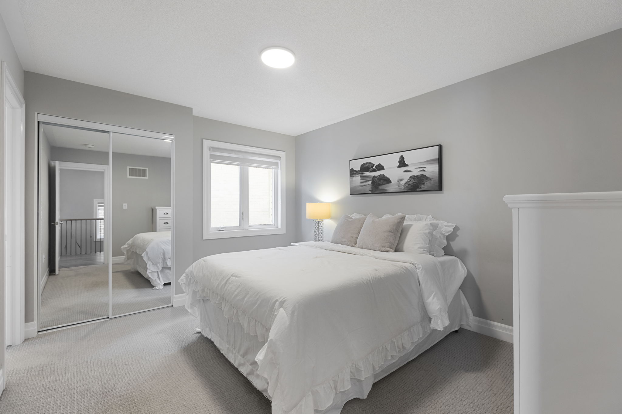 Bedroom with mirrored closet